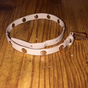 Light pink Tory Burch bracelet wrap.